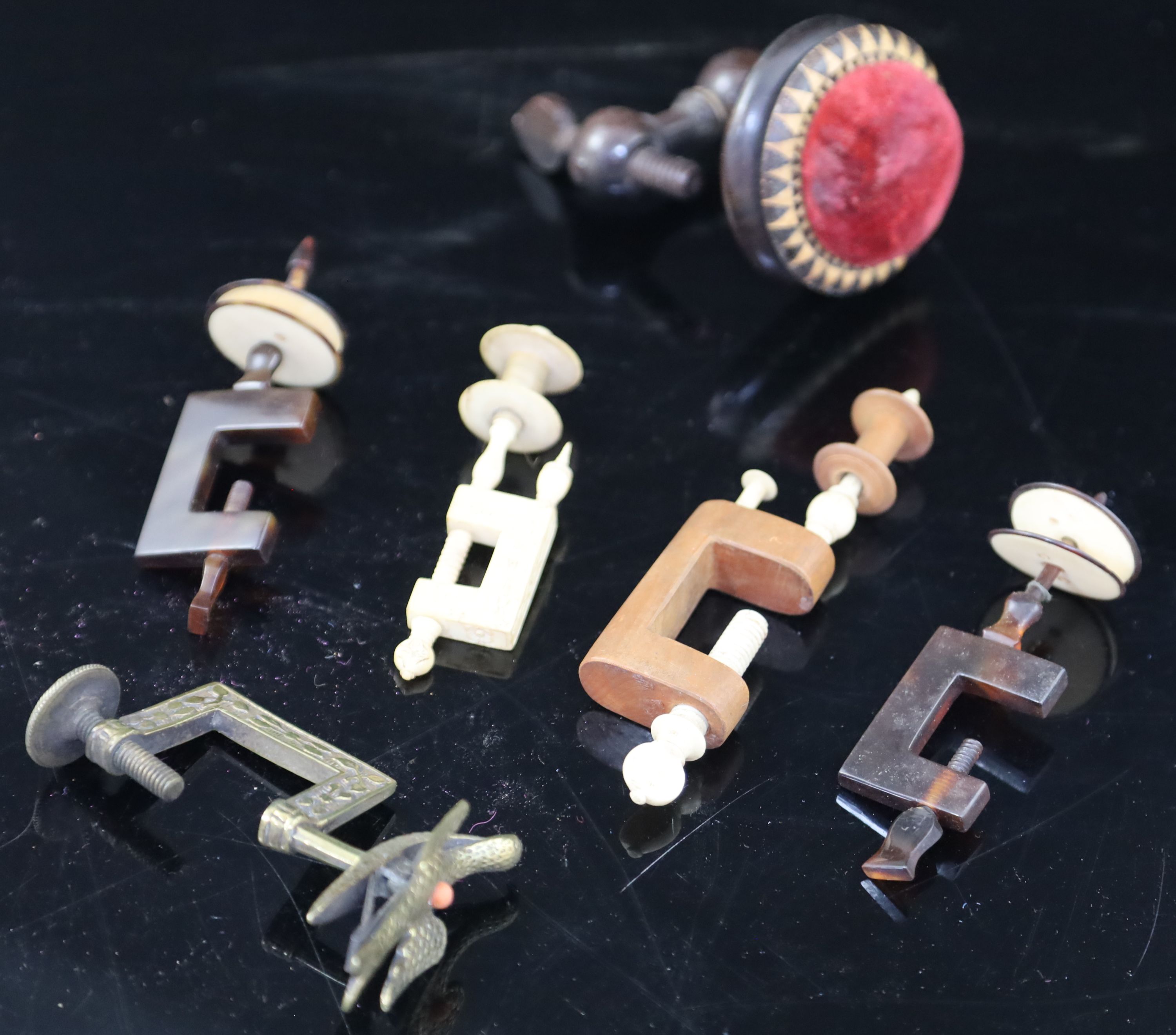 Five assorted early 19th century sewing clamps